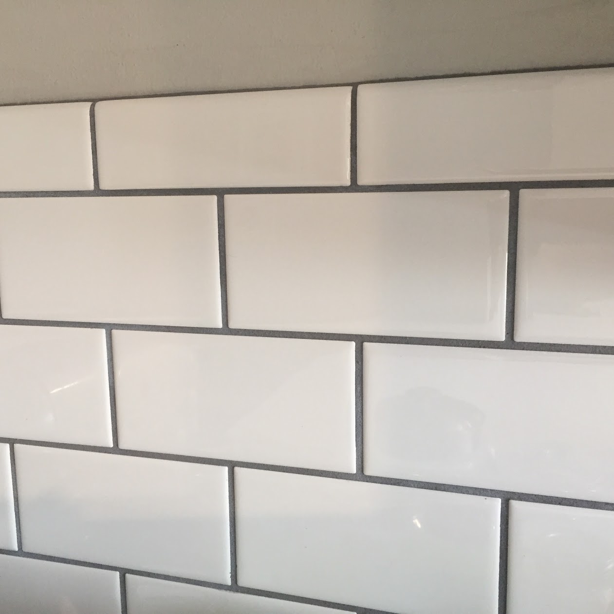 white subway tile backsplash with dark gray grout Teal Inspiration
